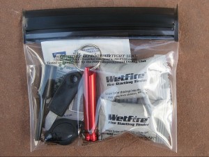 Ultralight essentials waterproof kit with light, firestarter, tinder, whistle, duct tape, and basic first aid