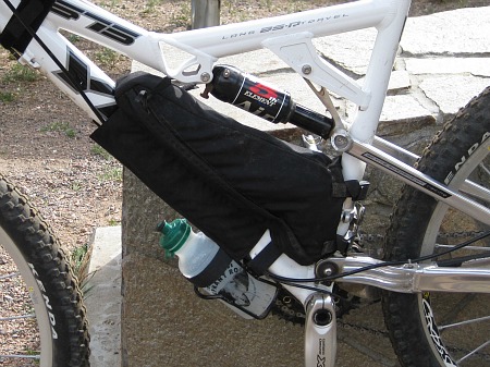 Jandd frame bag upside down with zippers on the bottom and a Lizard Skin velcro extension