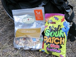 trail mix and sour patch kids serve as dinner for a bike packer